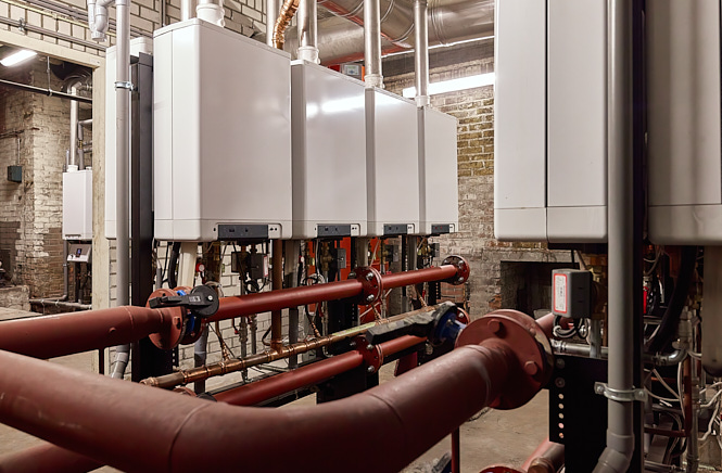 Meerdere cv ketels in een kelder van een VvE